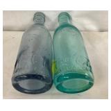 CLOSE UP VIEW STRAIGHTSIDED COKE BOTTLES