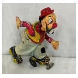 TIN LITHO WIND UP ROLLER BLADE MAN