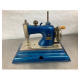 CHILDS TOY SEWING MACHINE