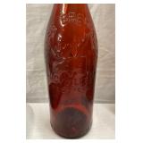 CLOSEUP EARLY EMBOSSED BOTTLE