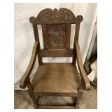 PRIM. CHAIR W/CARVINGS 