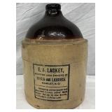 2g. E.A. Lackey Glazed Stoneware Jug with Advertising Label