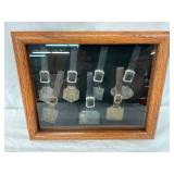 Framed Set of Seven Metal Watch Fobs with Leather Straps