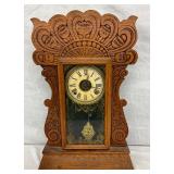 Carved Wood Mantel Clock with Glass Panel and Roman numeral dial 