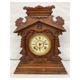 Wooden Mantel Clock with Architectural Design and Roman Numeral Dial