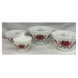 Four Milk Glass Mixing Bowls and Covered Sugar Bowl with Red and Black Floral Design