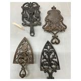 Four Decorative Cast Iron Trivets