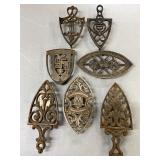 7 Cast Iron Trivets with Decorative Designs