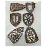 6 Cast Iron Trivets with Various Designs