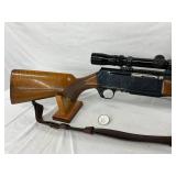 Rifle with Redfield Scope