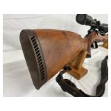 polished wood stock with dark checkered grip panel