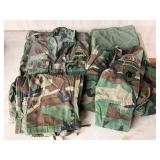 U.S. Army Uniform Items Including Jackets, Pants, and Duffle Bag