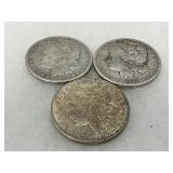 Three Morgan Silver Dollars: Two 1879 and One 1921