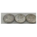 Three Morgan Silver Dollars: 1890, 1898, and 1921
