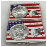 Two American Eagle Silver Dollar Coins in Display Cases