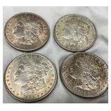 Four Morgan Silver Dollars (Various Dates and Mint Marks)