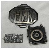 Three Metal Charms and Badge, 23 Grams Total Weight