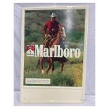 23×34 Metal Self-Framed Embossed Marlboro Advertisement with Cowboy