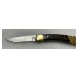 Buck 110 Folding Hunter Knife with Brass Bolsters and Wood Handle
