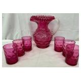 Cranberry Glass Reverse Thumbprint Water Pitcher with Fluted Top and Six Matching Tumblers