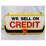 Double-Sided LEXAN Sign ‘We Sell on Credit,’ 28in x 14in