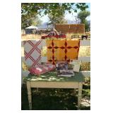 Lovely green and cream painted pine table, quilts, and decorating books