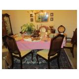 Dining table with 8 caned back chairs, area rug