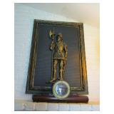 Tin wall plaque of conquistador 