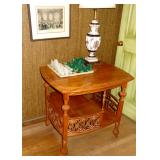 VINTAGE HONEY OAK DISPLAY TABLE ORNATE SCROLL CARVING ORIGINAL CASTERS