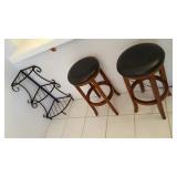 rod iron display case and bar stools