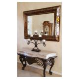 large entry way table and multi colored mirror