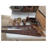 old hand saws, oil can, claw feet
