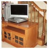 Contemporary TV stand on rollers and flatscreen TV