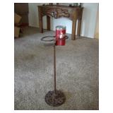 Horseshoe cup holder on antique stand
