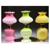 Many cased glass miniature lamps