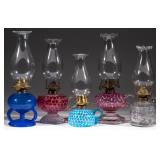 Many opalescent and other hand lamps