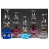 Many opalescent and other hand lamps