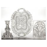 Many pieces of pressed lacy glass