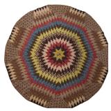 Unusual mid-19th century pieced table cover in a blazing star pattern incorporating chintz...