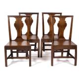 et of four Chippendale black walnut plank seat side chairs (circa 1780), American or British