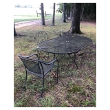 Wrought Iron Outdoor table and various chairs