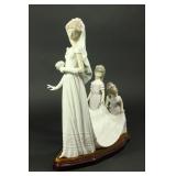 Lot 56: Lladro Porcelain Figurine "Here Comes the Bride" 