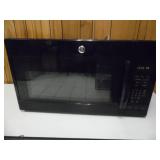 Working GE Over Range Gloss Black Microwave - current bid $10