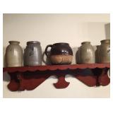 Crocks on antique pine shelf