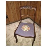 Antique chair with embroidered cushion