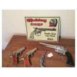 Cap guns and tin sign