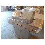Nexgrill 4-Burner Propane Gas Grill in Stainless Steel with Side Burner and Stainless Steel Doors