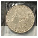 1885 MORGAN SILVER DOLLAR AU SEALED LITTLETON