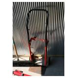 Hand Cart, Shovel, And a Telescope