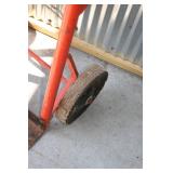 Hand Cart, Shovel, And a Telescope